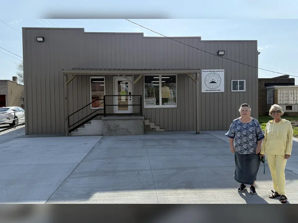 My Brother’s Place Director Connie Pelletier (right), along with volunteer Sharon Bush (left), is pictured outside of My Brother’s Place located on South Railroad Avenue across from The Depot in Wellston. The building inside and out along with the parking lot had undergone renovations thanks to state funding. This photo was taken in April 2025 after the outside renovations had been finished. (Telegram Photo by Jeremiah Shaver)