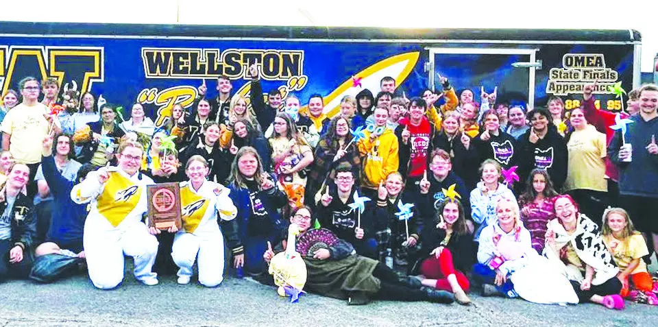 Shown here is a group photo of the 2025-2026 edition of the Wellston High School Golden Rockets Marching Band. Everyone is pictured holding up a number one gesture because the Marching Band earned a Superior rating after competing in the Ohio Music Education Association State Marching Band Finals on Saturday afternoon, Oct. 25 at Hilliard Bradley High School. (Photo Courtesy of Wellston Golden Rockets Marching Band Facebook Page)