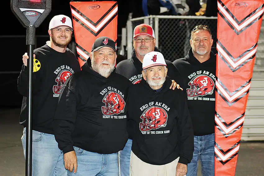 Retiring Jackson Ironmen football chain-gang crewman Hank McClurg is pictured with his fellow chain-gang crew members at the Ironmen’s Oct. 24 game when the 90-year-old was publicly honored for his 46 years of service. In the front row, from the left are Brian Moore and McClurg. In the back row, from the left are Andy Eisnaugle, Butch Cooper and Dusty Sexton. (Telegram Photo by Bryan Walters)