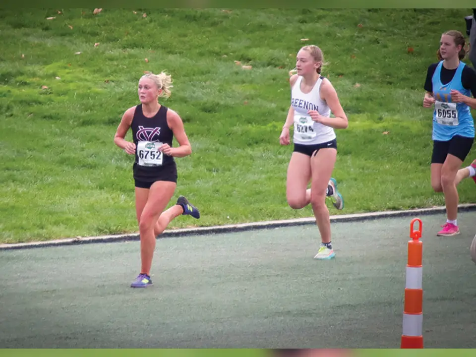 Vinton County junior Faith Goodson (left) turned in a strong performance, finishing 83rd out of 215 runners in the Division III girls state cross country championships Saturday at Fortress Obetz in Columbus. (Photo Credit: Donnie Goodson)