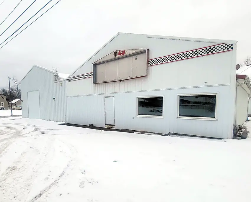 The former Victory Lane business building, located at 643 W. Main St. in McArthur, will be torn down soon to make way for a new Atomic Credit Union branch building. The recently purchased property is on the growing west side of the village and is considered valuable commercial property. (Telegram Photo by Red Thompson Jr.)