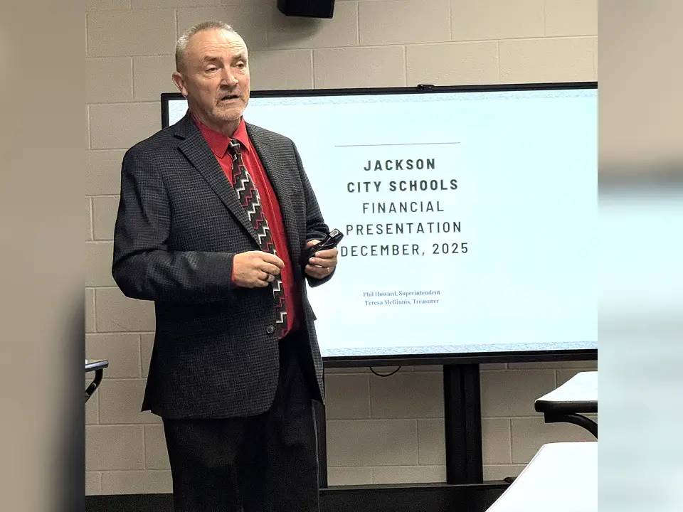 Jackson City Schools Superintendent Phil Howard is pictured giving a financial presentation to the Jackson City Board of Education members and those in attendance during a School Board meeting on Tuesday evening, Dec. 9. Howard recommended that the Board start the process of placing a 1.25 percent earned income tax on the May 2026 ballot for voters’ consideration. (Telegram Photo by Jeremiah Shaver)
