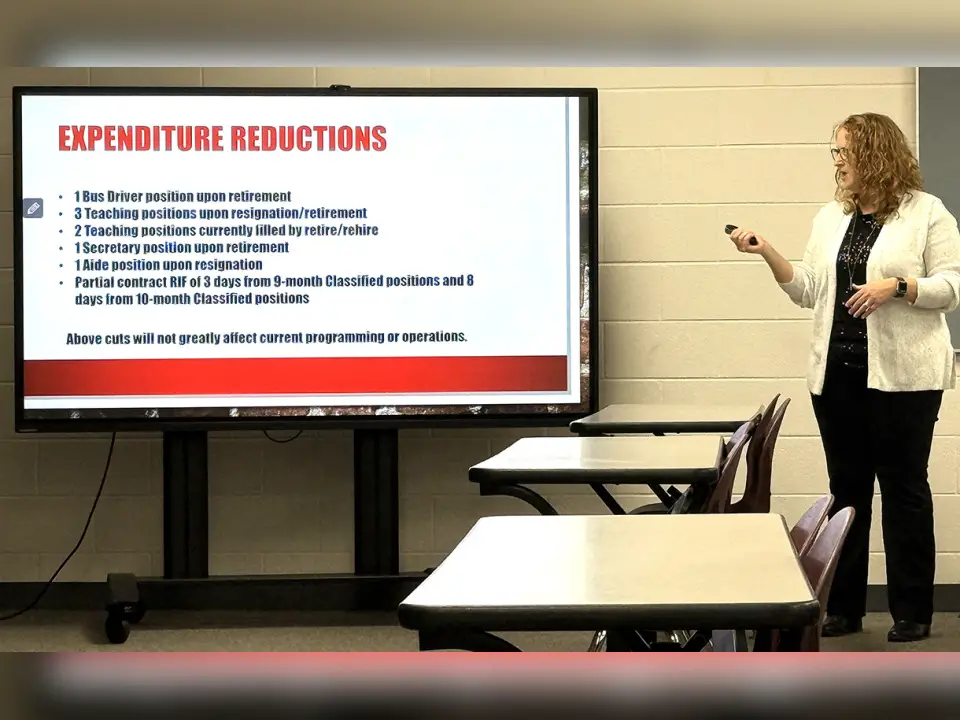 Jackson City Schools Treasurer Teresa McGinnis is pictured going over a presentation about a “precaution written plan” that the school district had to compile for the Ohio Department of Education and Workforce (ODEW). McGinnis remarked that the school district is facing a “deficit” in year three (FY2028). The slide on the screen shows cuts being made through “attrition” in order to eliminate the deficit in 2028 of the Financial Forecast. (Telegram Photo by Jeremiah Shaver)