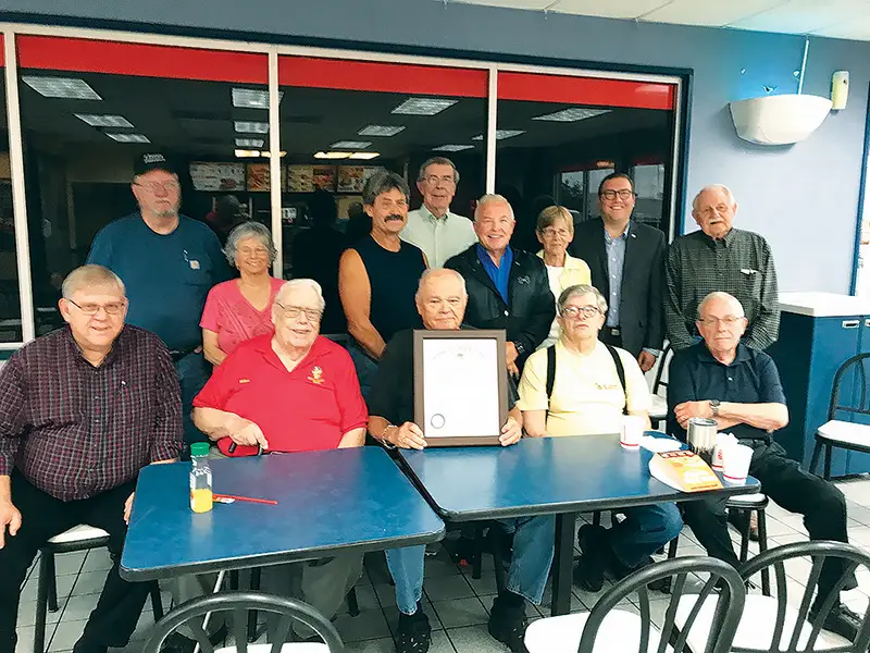 Tom Evans (seated center with plaque) received a major honor in 2022 when he was named as a local member of the honorary order of Kentucky Colonels. He is surrounded by other previously named local Kentucky Colonels. (Telegram File Photo by Pete Wilson)