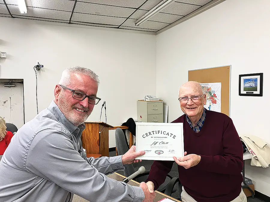 Jackson Mayor Randy Evans (left) is pictured as he presents a certificate of appreciation to At-Large City Councilman Jeff Elliott during the Dec. 22 meeting of Jackson City Council. The meeting was the last for Elliott as a Councilman as his term is ending at the end of December. Elliott has served as a Councilman for a total of 15 years over two different stints. (Telegram Photo by Pete Wilson)
