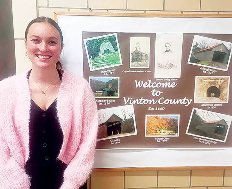 Vinton County Department of Tourism Director Amanda Mason, pictured here in the tourism office, resigned from her position, effective at the end of last Wednesday, Dec. 31. She excelled in her work and was admittedly was passionate about it; however, she is a new wife and expectant mother and she wants to have more time to take care of her family.  (Telegram Photo by Red Thompson, Jr.)